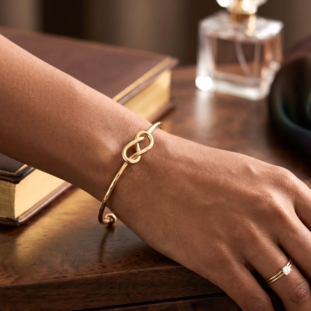 Zivara Infinity Knot Gold-Tone Open Cuff Bracelet